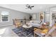 Comfortable living area with stylish decor, hardwood floors, and a modern rug at 116 W Stanley St, Tampa, FL 33604