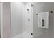 Elegant shower with white tile, glass enclosure, and modern fixtures at 116 W Stanley St, Tampa, FL 33604