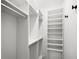Spacious walk-in closet featuring custom shelving and ample storage space at 116 W Stanley St, Tampa, FL 33604