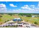 Gorgeous aerial view of the golf course and clubhouse with ample parking at 1177 Emerald Hill Way, Valrico, FL 33594