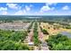 Aerial view of a charming neighborhood, golf course, and lake, showcasing a serene community setting at 1177 Emerald Hill Way, Valrico, FL 33594