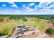 Beautiful aerial view of the golf course, trees, and ponds in the community at 1177 Emerald Hill Way, Valrico, FL 33594