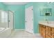Bright bathroom with a tub, separate shower, and vanity with wood cabinets at 1177 Emerald Hill Way, Valrico, FL 33594