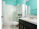 Bathroom featuring modern fixtures, a shower-tub combo, and ample storage space at 1177 Emerald Hill Way, Valrico, FL 33594