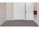 Bedroom with neutral carpet and a closet, bathed in natural light at 1177 Emerald Hill Way, Valrico, FL 33594