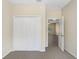 Bedroom with neutral carpet and a closet, bathed in natural light at 1177 Emerald Hill Way, Valrico, FL 33594