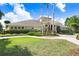 Community center exterior with well manicured landscaping, sidewalks and large columns at 1177 Emerald Hill Way, Valrico, FL 33594