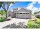 Traditional single-Gathering home boasting a two-car garage and meticulously kept landscaping at 1177 Emerald Hill Way, Valrico, FL 33594