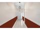 Welcoming hallway featuring neutral tile floors, contemporary lighting, and decorative wall accents at 1177 Emerald Hill Way, Valrico, FL 33594