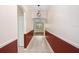 Inviting entryway with neutral tile flooring, decorative lighting, and stylish wall trim at 1177 Emerald Hill Way, Valrico, FL 33594