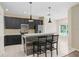 Well-equipped kitchen with stainless steel appliances, bar seating, and ample counter space at 1177 Emerald Hill Way, Valrico, FL 33594