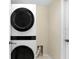 Laundry room with stacked washer and dryer at 1177 Emerald Hill Way, Valrico, FL 33594