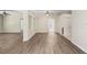 Expansive living room featuring laminate flooring, neutral paint, and an open layout, perfect for entertaining at 1177 Emerald Hill Way, Valrico, FL 33594