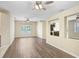 Inviting living space with modern wood flooring, natural light, and an open layout at 1177 Emerald Hill Way, Valrico, FL 33594