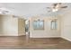 Open-concept living room boasting stylish flooring, neutral paint, and seamless flow to other areas at 1177 Emerald Hill Way, Valrico, FL 33594