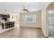 Open floor plan shows the living room connected to a modern kitchen with bar seating at 1177 Emerald Hill Way, Valrico, FL 33594