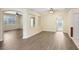 Bright living room with wood-look floors, neutral walls, and ample space for entertaining and relaxing at 1177 Emerald Hill Way, Valrico, FL 33594