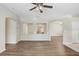 Spacious living room featuring wood floors, neutral paint, and open design for flexible living at 1177 Emerald Hill Way, Valrico, FL 33594