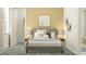 Cozy bedroom with ample natural light, stylish decor and a comfortable queen-sized bed at 12054 Violet Jasper Dr, Parrish, FL 34219