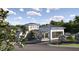 Elegant community entrance with covered walkways, lush landscaping, and visitor parking at 12054 Violet Jasper Dr, Parrish, FL 34219