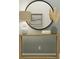 Elegant entryway console table with round mirror and decor creates a welcoming ambiance at 12054 Violet Jasper Dr, Parrish, FL 34219