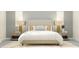Relaxing main bedroom with a neutral color palette, comfortable bed, and stylish nightstands at 12054 Violet Jasper Dr, Parrish, FL 34219