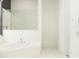 Modern bathroom with soaking tub, tiled walls, and stylish fixtures at 12058 Violet Jasper Dr, Parrish, FL 34219