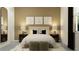 Serene bedroom features a plush bed, matching nightstands and decorative botanical artwork at 12058 Violet Jasper Dr, Parrish, FL 34219
