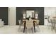 Elegant dining area featuring a black dining table and chairs, modern decor, and ample lighting at 12058 Violet Jasper Dr, Parrish, FL 34219