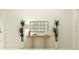 Bright hallway featuring decor, table with lamp, mirror and a plant on each side at 12058 Violet Jasper Dr, Parrish, FL 34219