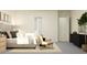 Bright main bedroom with sitting area, ample closet space, and modern design at 12058 Violet Jasper Dr, Parrish, FL 34219