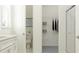 Bright, minimalist bathroom featuring a walk-in shower and a view into a walk-in closet at 12062 Violet Jasper Dr, Parrish, FL 34219