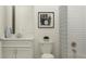 Neat bathroom featuring a vanity with a solid-surface counter and subway tile in the shower at 12062 Violet Jasper Dr, Parrish, FL 34219