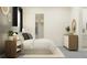 Nicely-staged bedroom with muted colors, a decorative rug, and closet access at 12062 Violet Jasper Dr, Parrish, FL 34219