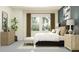 Calm bedroom features a comfortable bed, side tables, natural light, and tasteful decorations at 12062 Violet Jasper Dr, Parrish, FL 34219