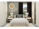 Charming bedroom featuring black-out curtains, neutral tones, and an ensuite closet at 12062 Violet Jasper Dr, Parrish, FL 34219