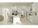 Spacious kitchen with white cabinets, stainless steel appliances, an island, and an eat-in dining area at 12062 Violet Jasper Dr, Parrish, FL 34219