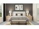 Stylish bedroom with a large bed, a neutral color scheme, and views to the bathroom at 12062 Violet Jasper Dr, Parrish, FL 34219