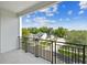 Private balcony with black metal railing and a view of the neighborhood at 121 E Warren Ave # 1, Tampa, FL 33602
