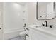 Bright bathroom featuring subway tile and a dual sink vanity at 121 E Warren Ave # 1, Tampa, FL 33602