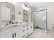 Stylish bathroom features double sinks and a modern tiled shower at 121 E Warren Ave # 1, Tampa, FL 33602