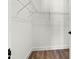 Walk-in closet offers wire shelving and wood look laminate flooring at 121 E Warren Ave # 1, Tampa, FL 33602