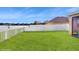 A sprawling backyard offers endless possibilities for outdoor activities, gardening, and relaxation at 13414 Graham Yarden Dr, Riverview, FL 33579