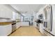 Spacious kitchen equipped with stainless steel appliances, granite countertops, and ample storage space at 13414 Graham Yarden Dr, Riverview, FL 33579
