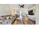 Comfortable living room featuring hardwood floors, a ceiling fan, and a neutral color palette at 13414 Graham Yarden Dr, Riverview, FL 33579