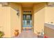 Charming entryway with decorative glass door and stylish accents at 1348 Emerald Dunes Dr, Sun City Center, FL 33573