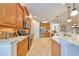 Gourmet kitchen with granite countertops and stainless steel appliances at 1348 Emerald Dunes Dr, Sun City Center, FL 33573