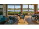 Inviting lanai with cozy seating, tile flooring, and tranquil water views for relaxing afternoons at 1348 Emerald Dunes Dr, Sun City Center, FL 33573