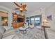Cozy living room with custom built-ins and serene lake views at 1348 Emerald Dunes Dr, Sun City Center, FL 33573