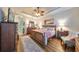 Spacious main bedroom features a tray ceiling, stylish furnishings, and ample natural light, creating a relaxing space at 1348 Emerald Dunes Dr, Sun City Center, FL 33573